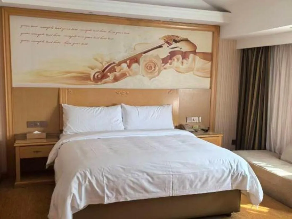 Bed in Vienna Hotel Hunan Jishou Fenghuang Ancient City