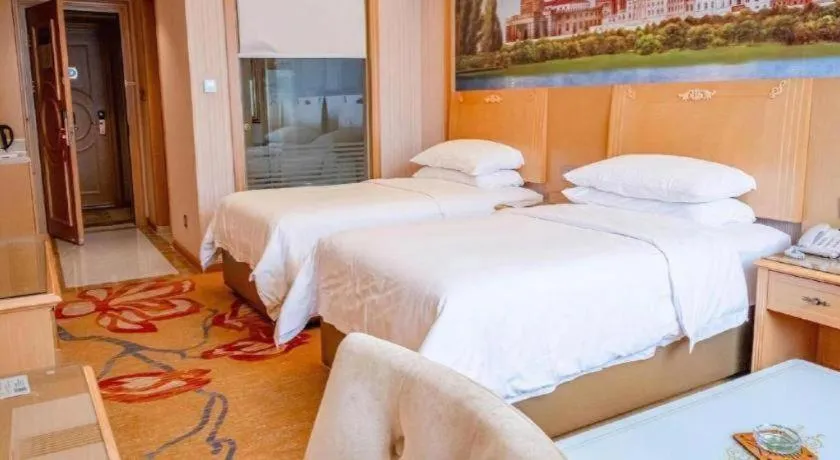 Bed in Vienna Hotel Hunan Jishou Fenghuang Ancient City