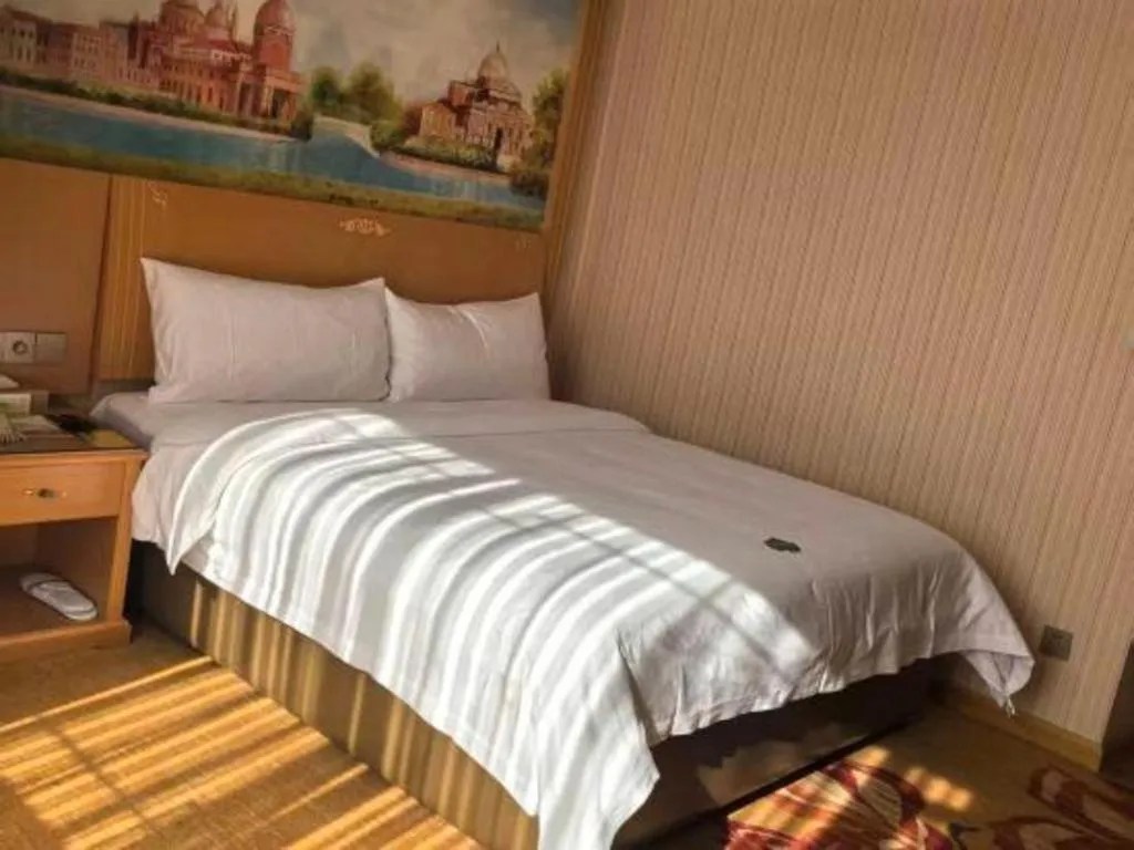 Bed in Vienna Hotel Hunan Jishou Fenghuang Ancient City