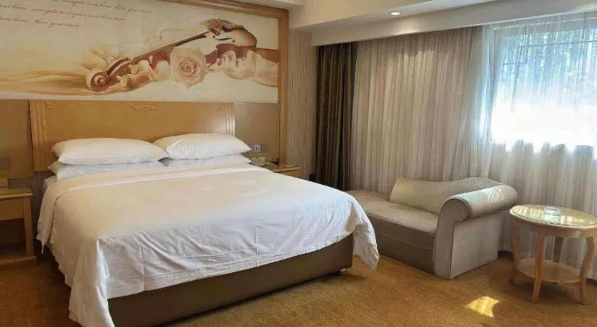 Bed in Vienna Hotel Hunan Jishou Fenghuang Ancient City