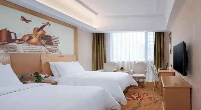 Bed in Vienna Hotel Hunan Jishou Fenghuang Ancient City