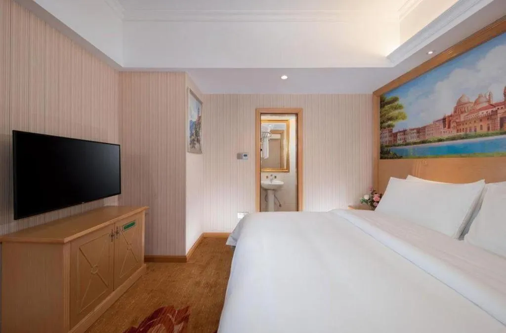 Bed in Vienna Hotel Hunan Jishou Fenghuang Ancient City