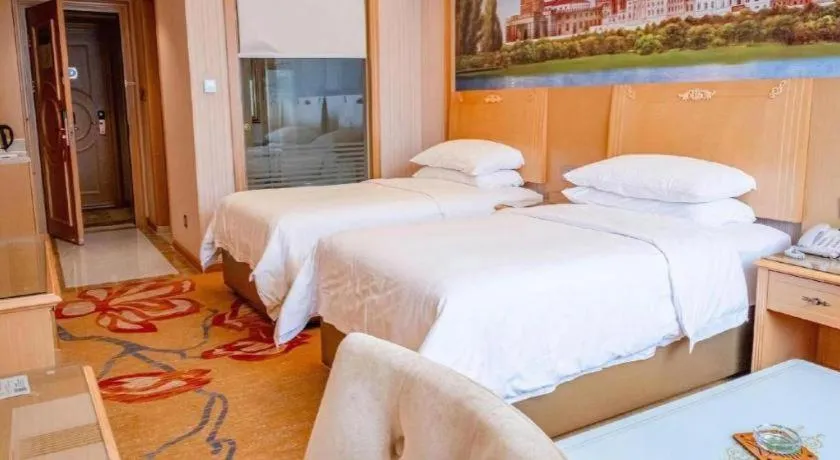 Bed in Vienna Hotel Hunan Jishou Fenghuang Ancient City