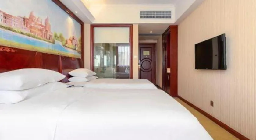 Bed in Vienna Hotel Guangdong Zhongshan Ancient Town Lighting Expo Center
