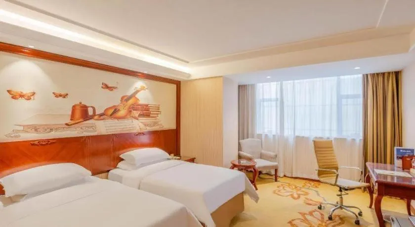 Bed in Vienna Hotel Guangdong Zhongshan Ancient Town Lighting Expo Center
