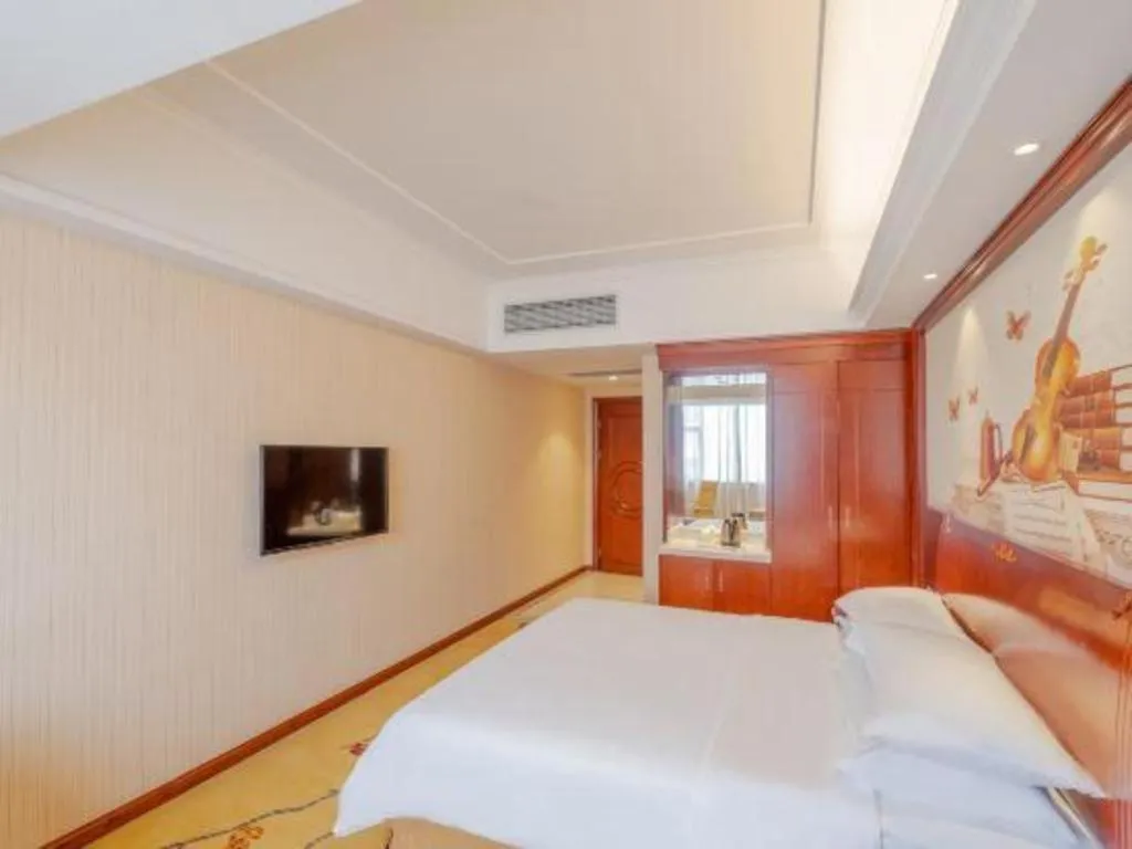 Bed in Vienna Hotel Guangdong Zhongshan Ancient Town Lighting Expo Center