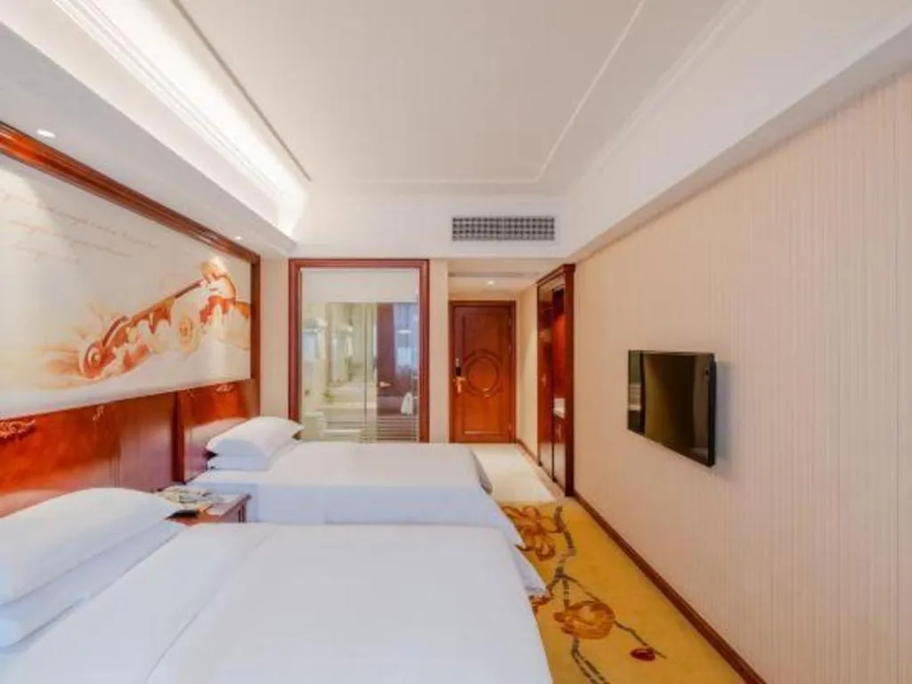 Bed in Vienna Hotel Guangdong Zhongshan Ancient Town Lighting Expo Center