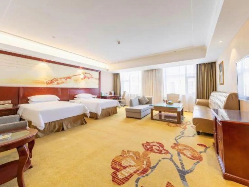 Bed in Vienna Hotel Guangdong Zhongshan Ancient Town Lighting Expo Center