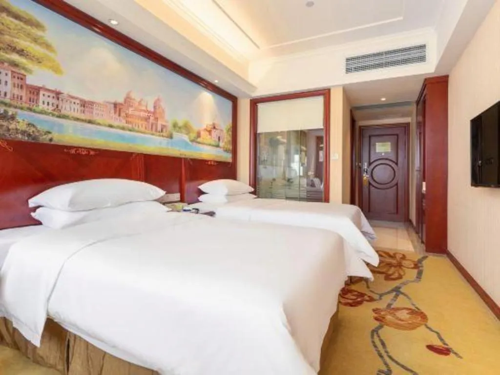 Bed in Vienna Hotel Guangdong Zhongshan Ancient Town Lighting Expo Center