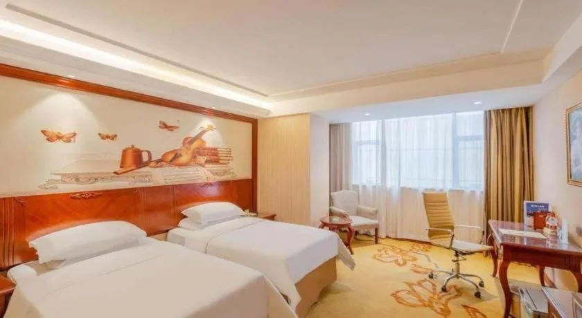 Bed in Vienna Hotel Guangdong Zhongshan Ancient Town Lighting Expo Center
