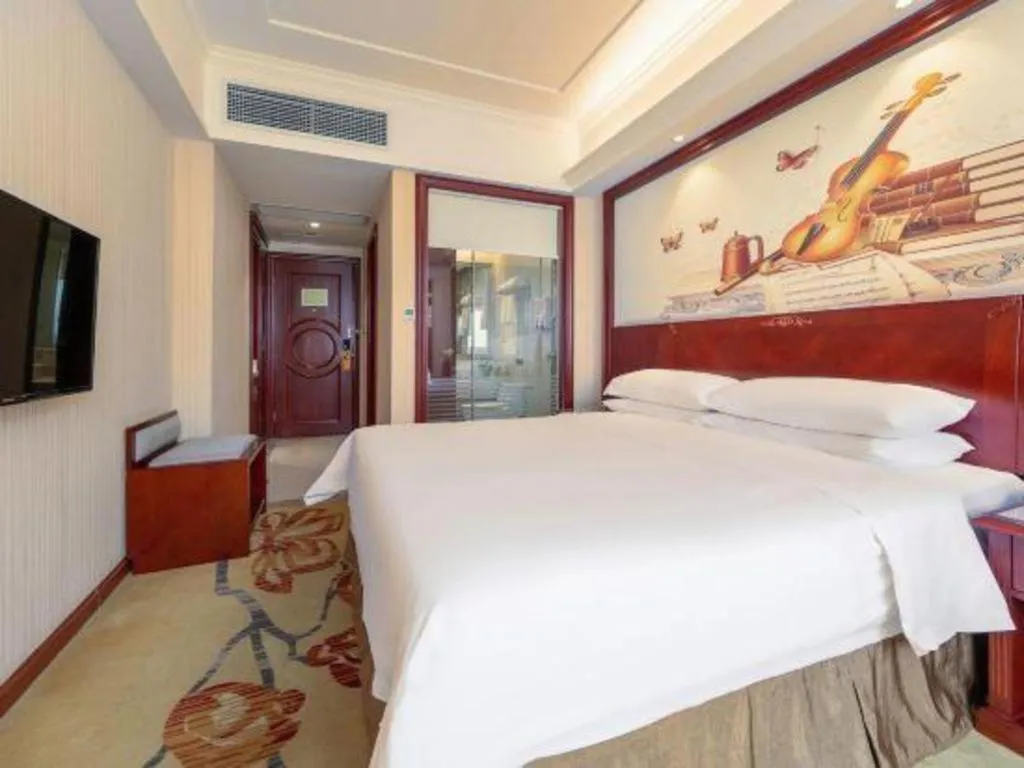 Bed in Vienna Hotel Guangdong Zhongshan Ancient Town Lighting Expo Center