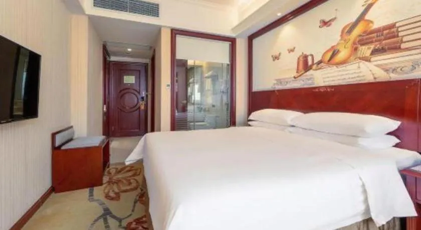 Bed in Vienna Hotel Guangdong Zhongshan Ancient Town Lighting Expo Center
