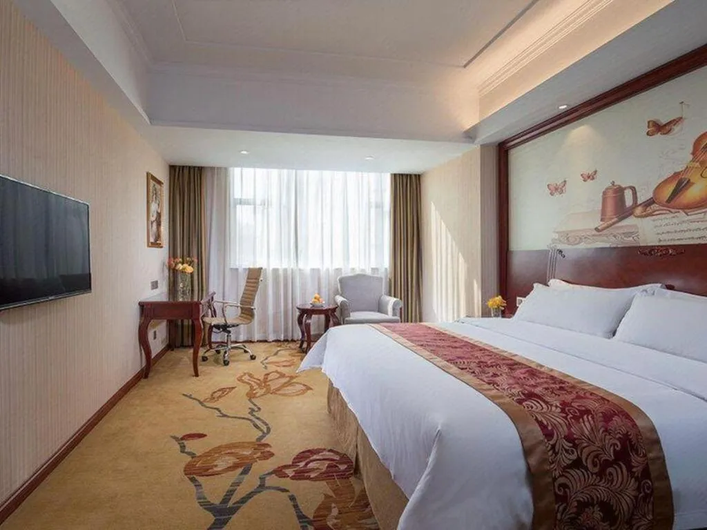 Bed in Vienna Hotel Guangdong Zhongshan Ancient Town Lighting Expo Center