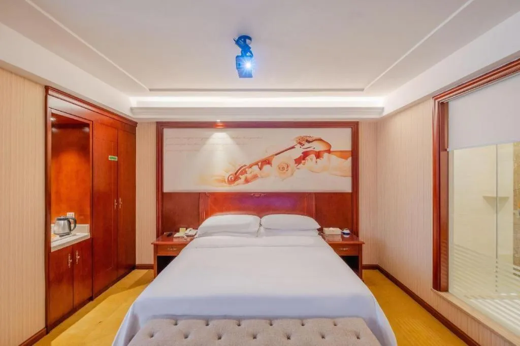 Bed in Vienna Hotel Guangdong Zhongshan Ancient Town Lighting Expo Center