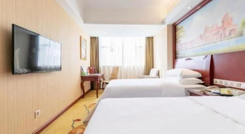 Bed in Vienna Hotel Guangdong Zhongshan Ancient Town Lighting Expo Center