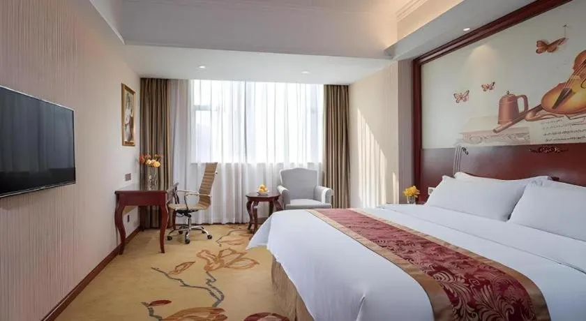 Bed in Vienna Hotel Guangdong Zhongshan Ancient Town Lighting Expo Center