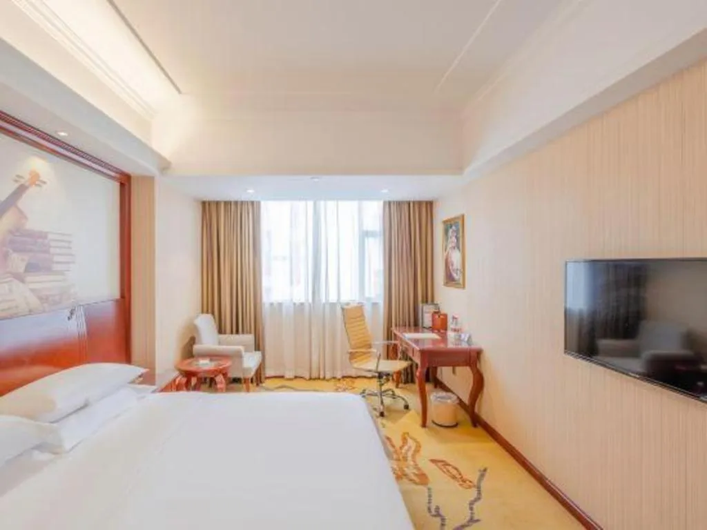 Bed in Vienna Hotel Guangdong Zhongshan Ancient Town Lighting Expo Center