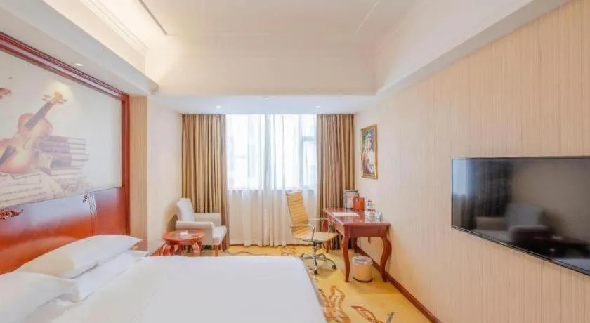 Bed in Vienna Hotel Guangdong Zhongshan Ancient Town Lighting Expo Center