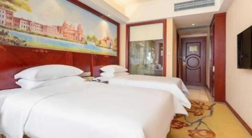 Bed in Vienna Hotel Guangdong Zhongshan Ancient Town Lighting Expo Center