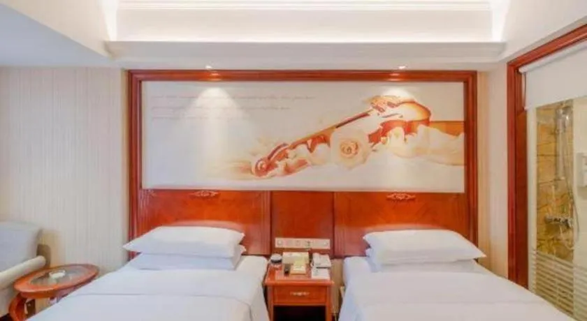 Bed in Vienna Hotel Guangdong Zhongshan Ancient Town Lighting Expo Center