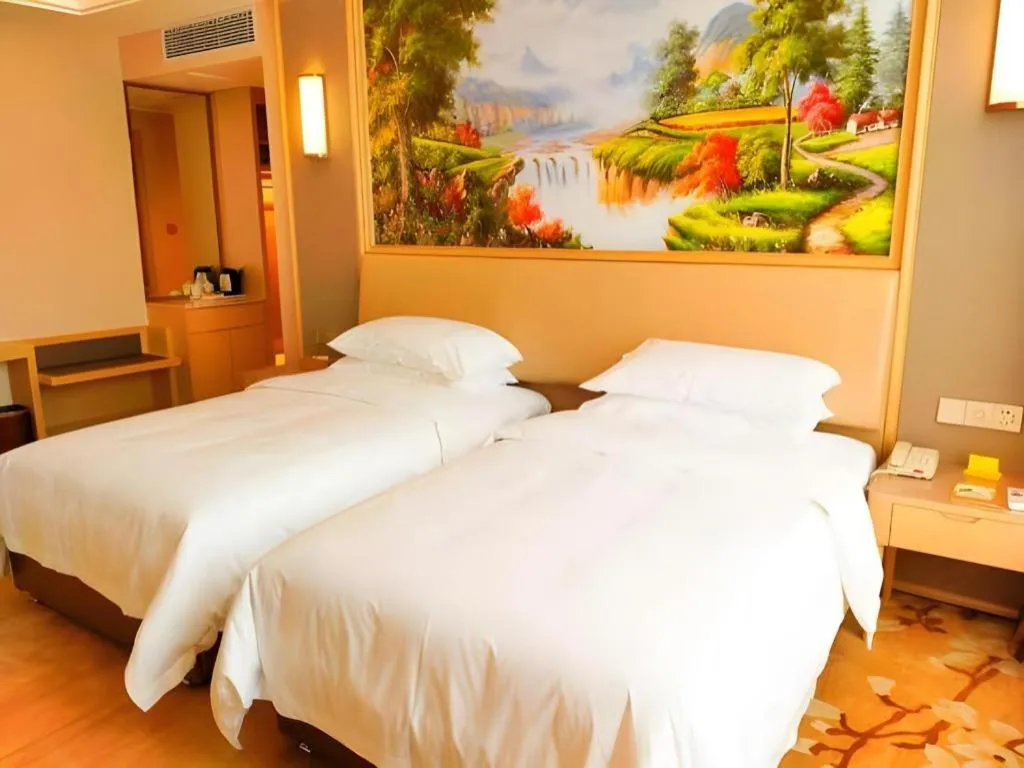 Bed in Vienna Hotel Fujian Fuqing Wanda Plaza