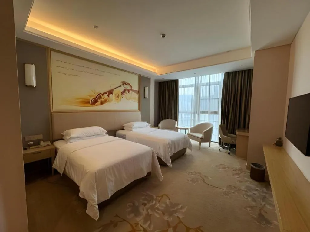 Bed in Vienna Hotel Fujian Fuqing Wanda Plaza