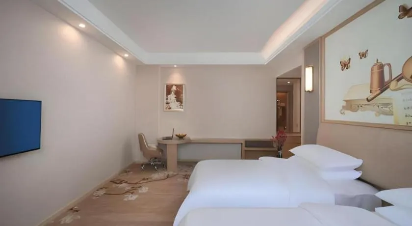 Bed in Vienna Hotel Fujian Fuqing Wanda Plaza