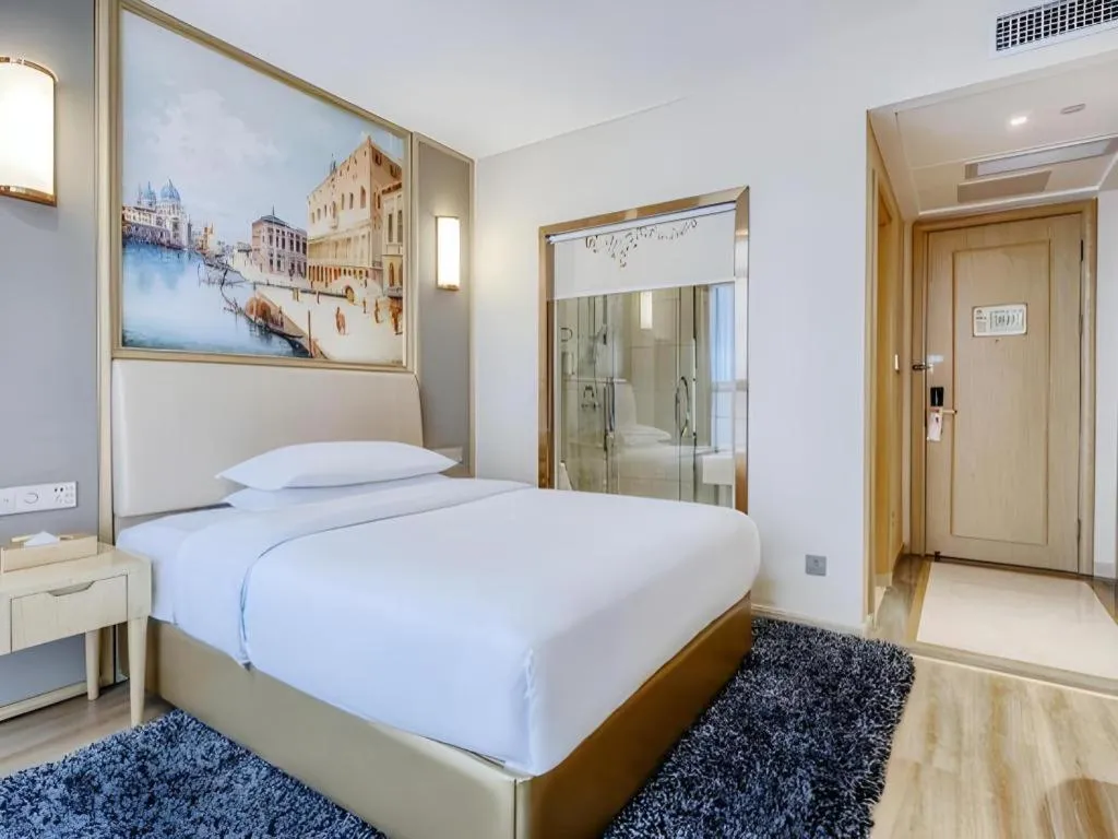 Bed in Vienna Hotel Fujian Fuqing Wanda Plaza