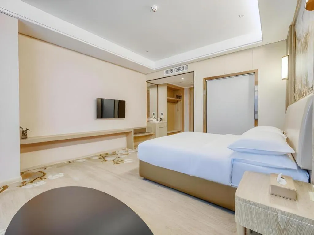 Bed in Vienna Hotel Fujian Fuqing Wanda Plaza