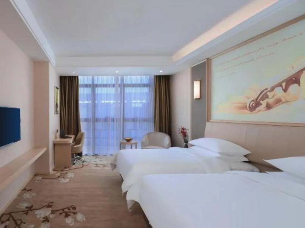 Bed in Vienna Hotel Fujian Fuqing Wanda Plaza