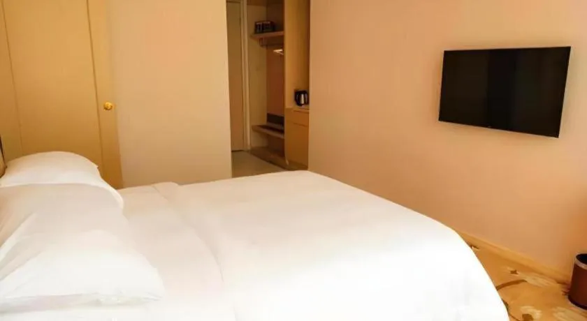 Bed in Vienna Hotel Fujian Fuqing Wanda Plaza