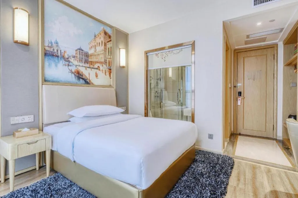 Bed in Vienna Hotel Fujian Fuqing Wanda Plaza