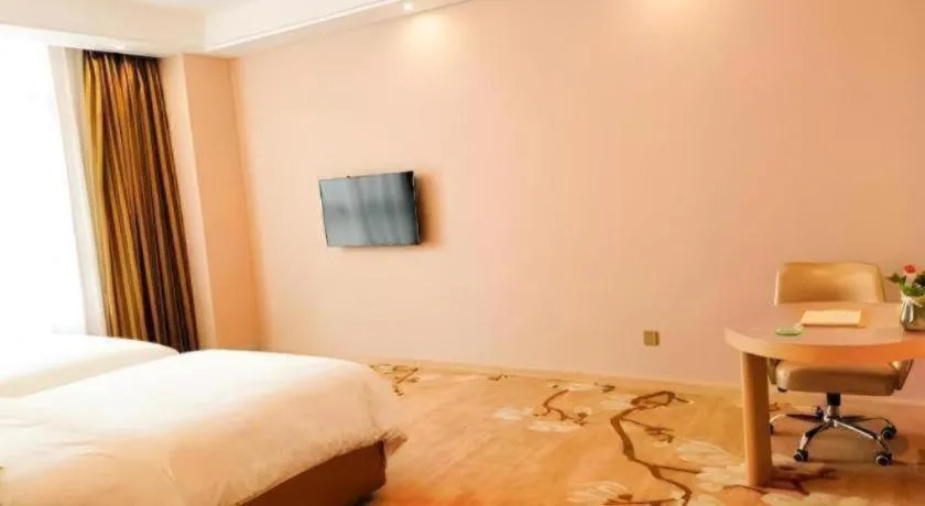 Bed in Vienna Hotel Fujian Fuqing Wanda Plaza