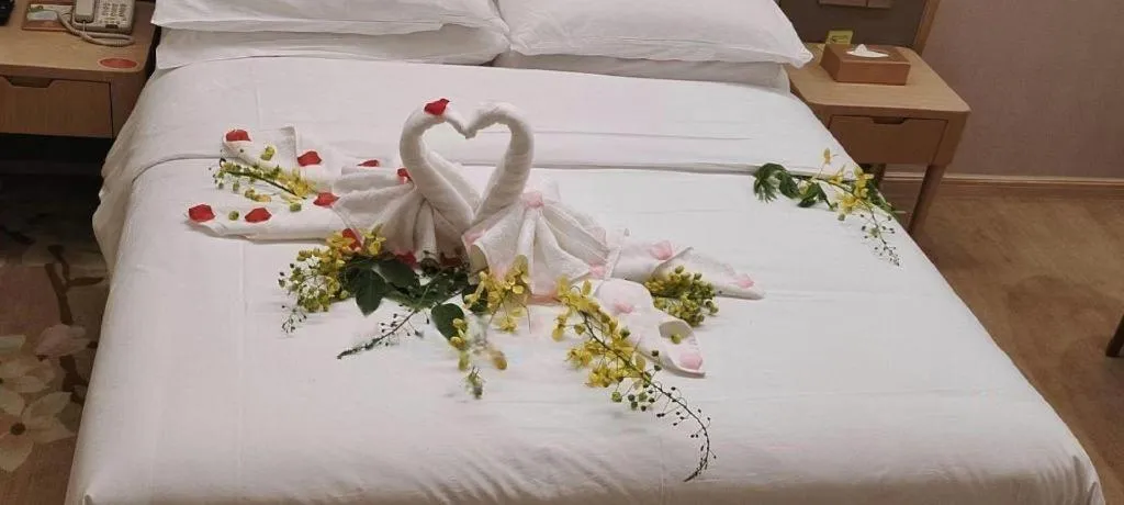 Bed in Vienna Hotel Fujian Fuqing Wanda Plaza