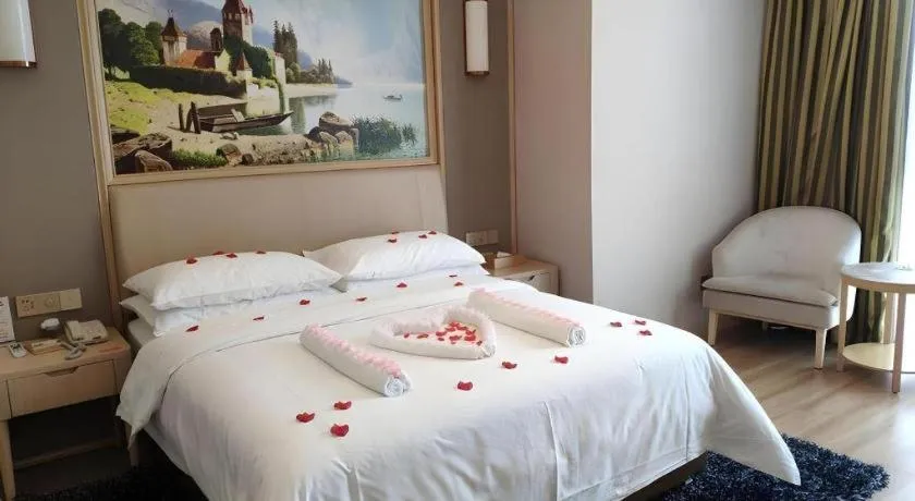 Bed in Vienna Hotel Fujian Fuqing Wanda Plaza