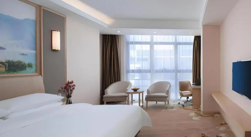 Bed in Vienna Hotel Fujian Fuqing Wanda Plaza