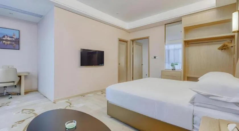 Bed in Vienna Hotel Fujian Fuqing Wanda Plaza