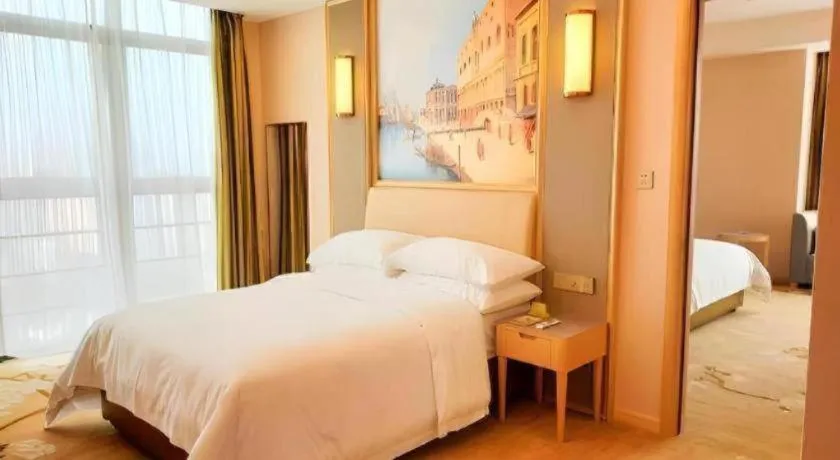 Bed in Vienna Hotel Fujian Fuqing Wanda Plaza