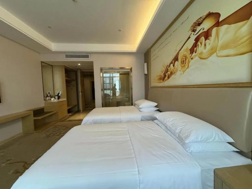 Bed in Vienna Hotel Fujian Fuqing Wanda Plaza