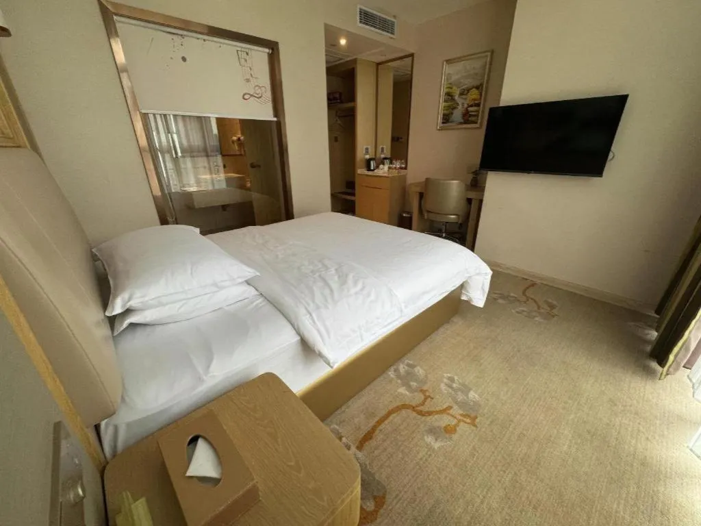 Bed in Vienna Hotel Fujian Fuqing Wanda Plaza