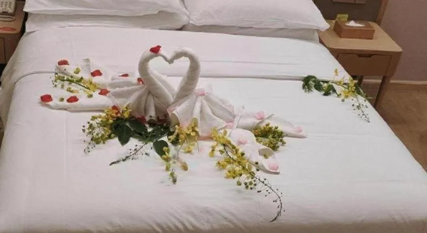 Bed in Vienna Hotel Fujian Fuqing Wanda Plaza