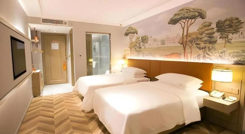 Bed in Vienna Hotel Jinan Beiyuan Street Red Star Macalline