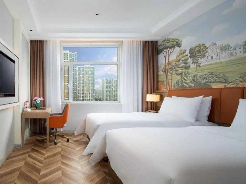 Bed in Vienna Hotel Jinan Beiyuan Street Red Star Macalline