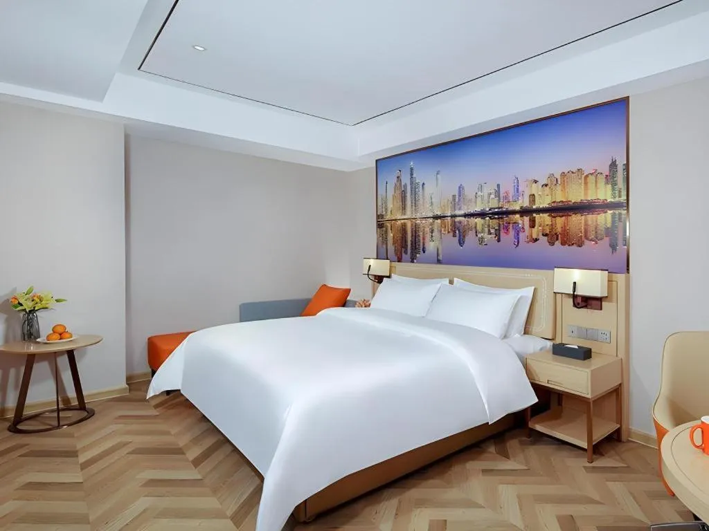 Bed in Vienna Hotel Guangxi Baise Xilin County Juting Cultural Arts Center