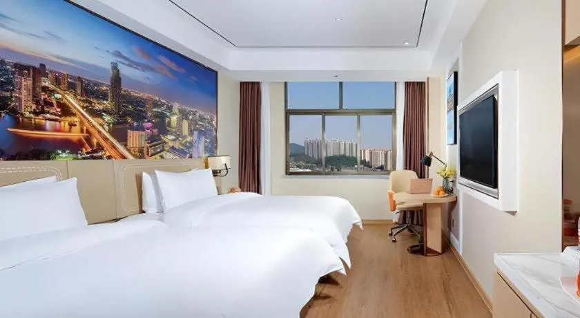 Bed in Vienna Hotel Guangxi Baise Xilin County Juting Cultural Arts Center