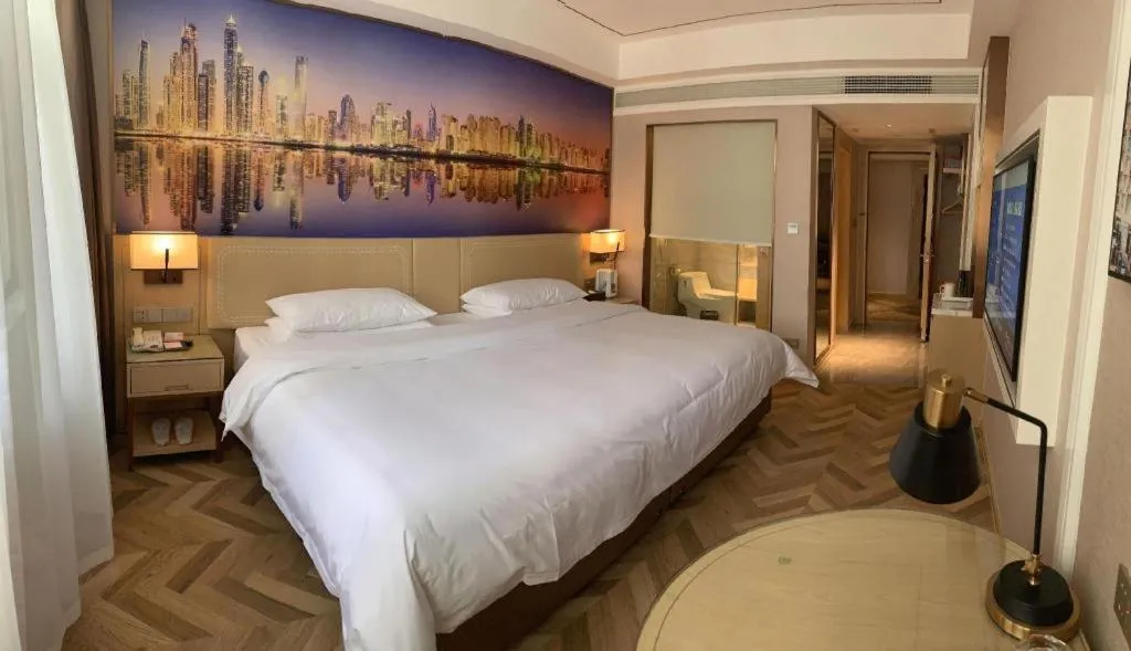 Bed in Vienna Hotel Guangxi Baise Xilin County Juting Cultural Arts Center