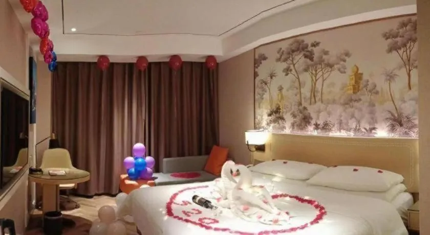 Bed in Vienna Hotel Guangxi Baise Xilin County Juting Cultural Arts Center