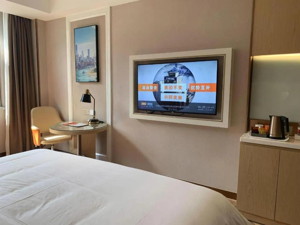 Bed in Vienna Hotel Guangxi Baise Xilin County Juting Cultural Arts Center