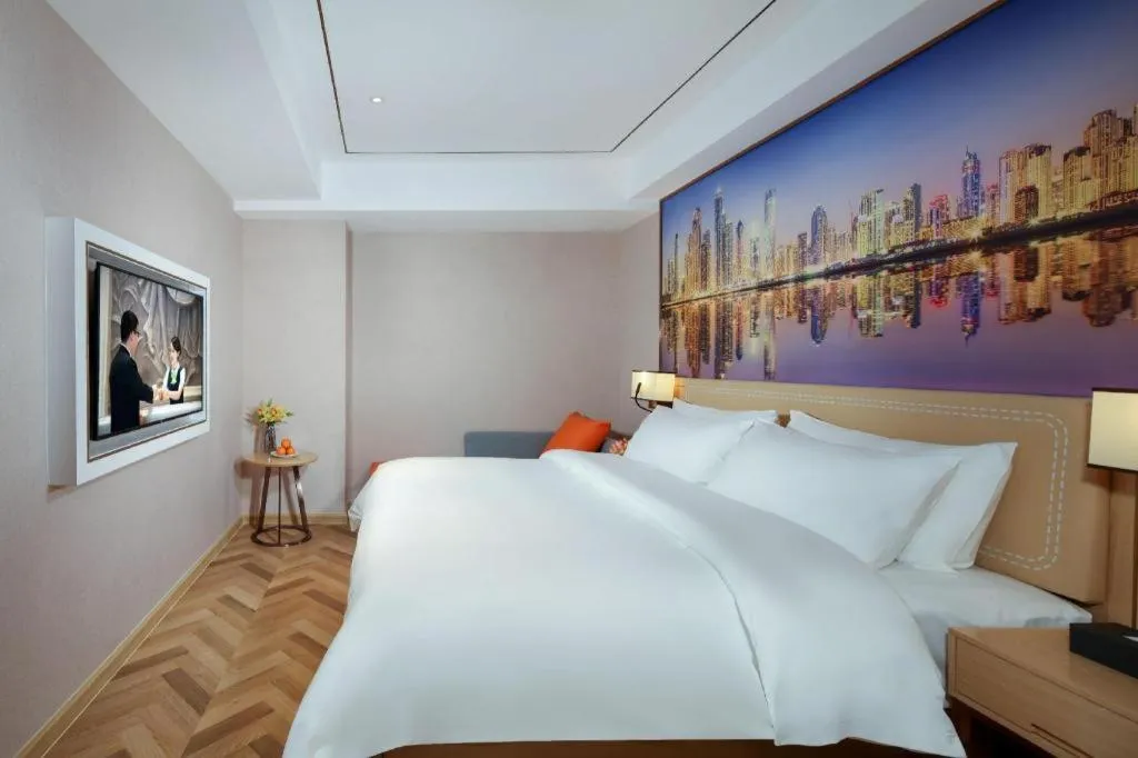 Bed in Vienna Hotel Guangxi Baise Xilin County Juting Cultural Arts Center