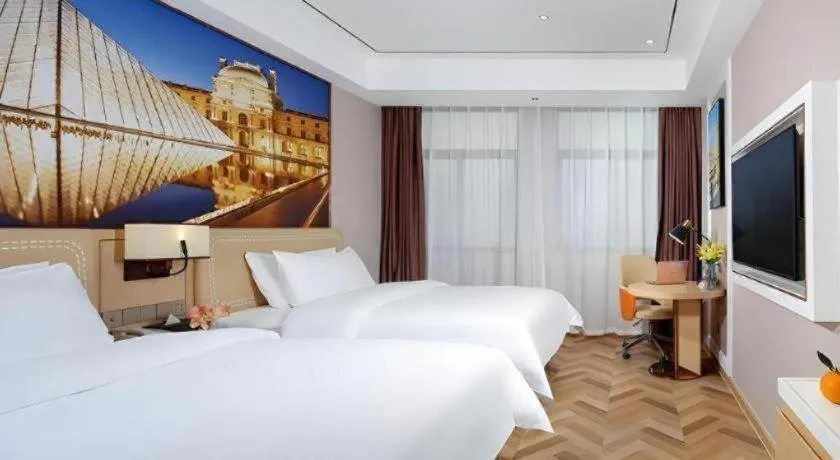 Bed in Vienna Hotel Guangxi Baise Xilin County Juting Cultural Arts Center